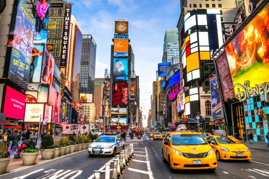 NEW YORK CITY - DEC 01 Times Square ,is a busy tourist intersection of neon art and commerce and is an iconic street of New York City and America, December 01th, 2013 in Manhattan, New York City.